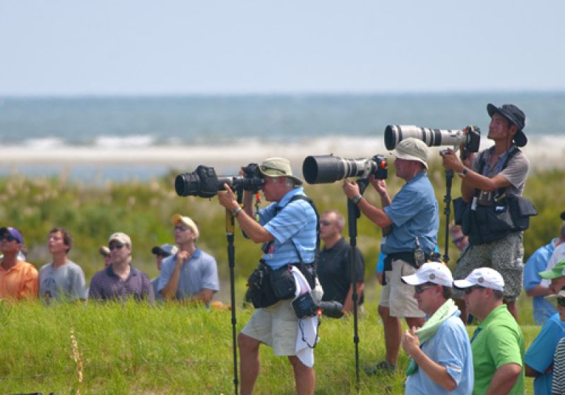 Photographers lining up with the big lenses as Bubba Watson nears the turn.
