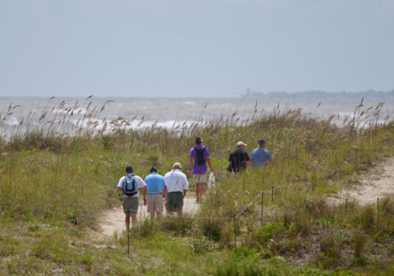Fans taking a stroll along the dunes of the back nine.