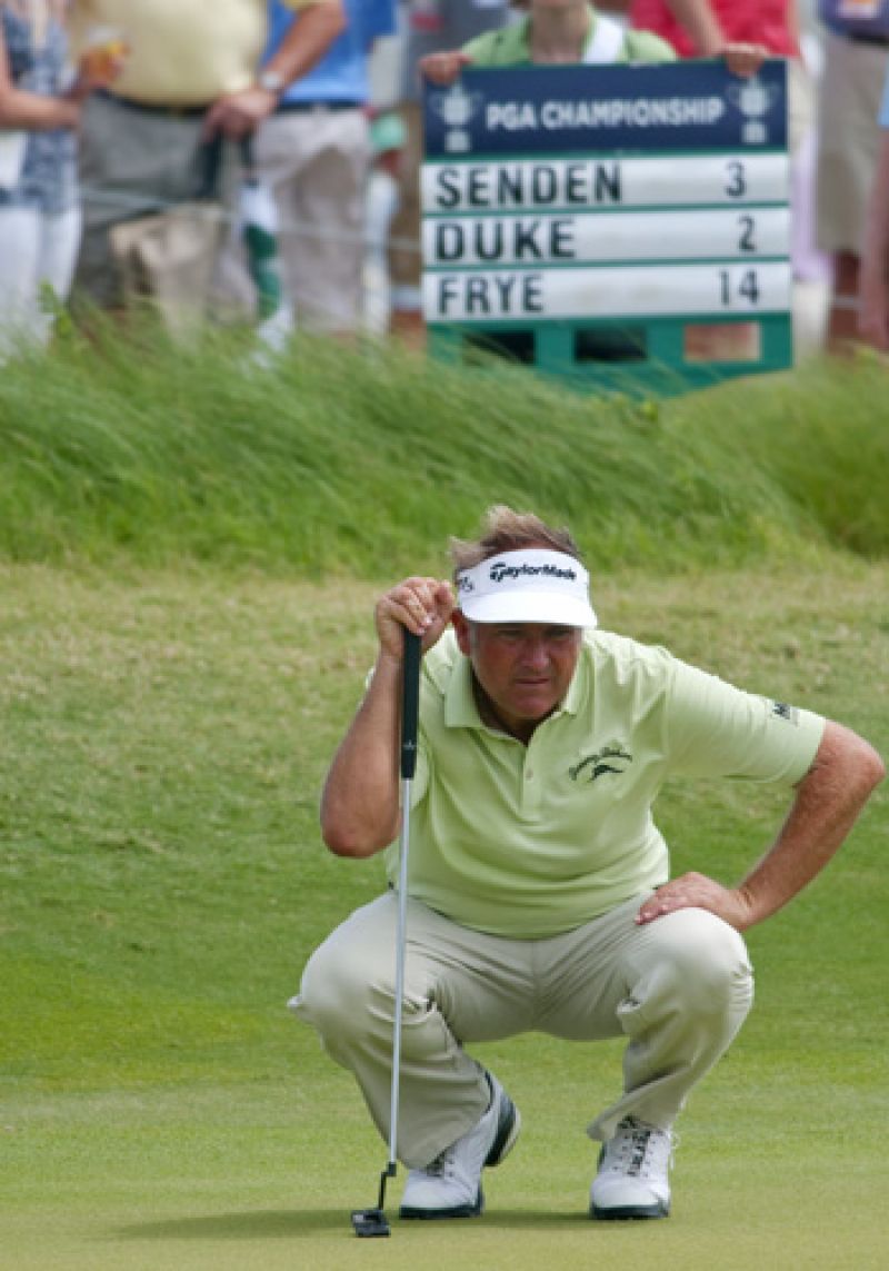 Lining up a put on the 16th green.