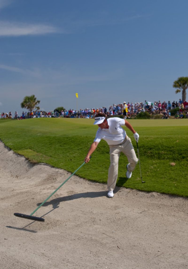 Some pros even rake the bunkers themselves.