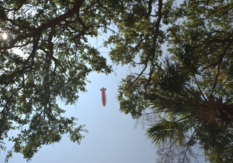 The blimp far above the live oaks on the front nine.