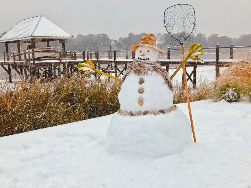 <strong>In the Marsh We Can Build a Snowman:</strong> In West Ashley, the Lipov family built the quintessential Lowcountry snow-fisherman, complete with palmetto frond hands and oyster shell buttons; <em>photograph by Larry Lipov</em>