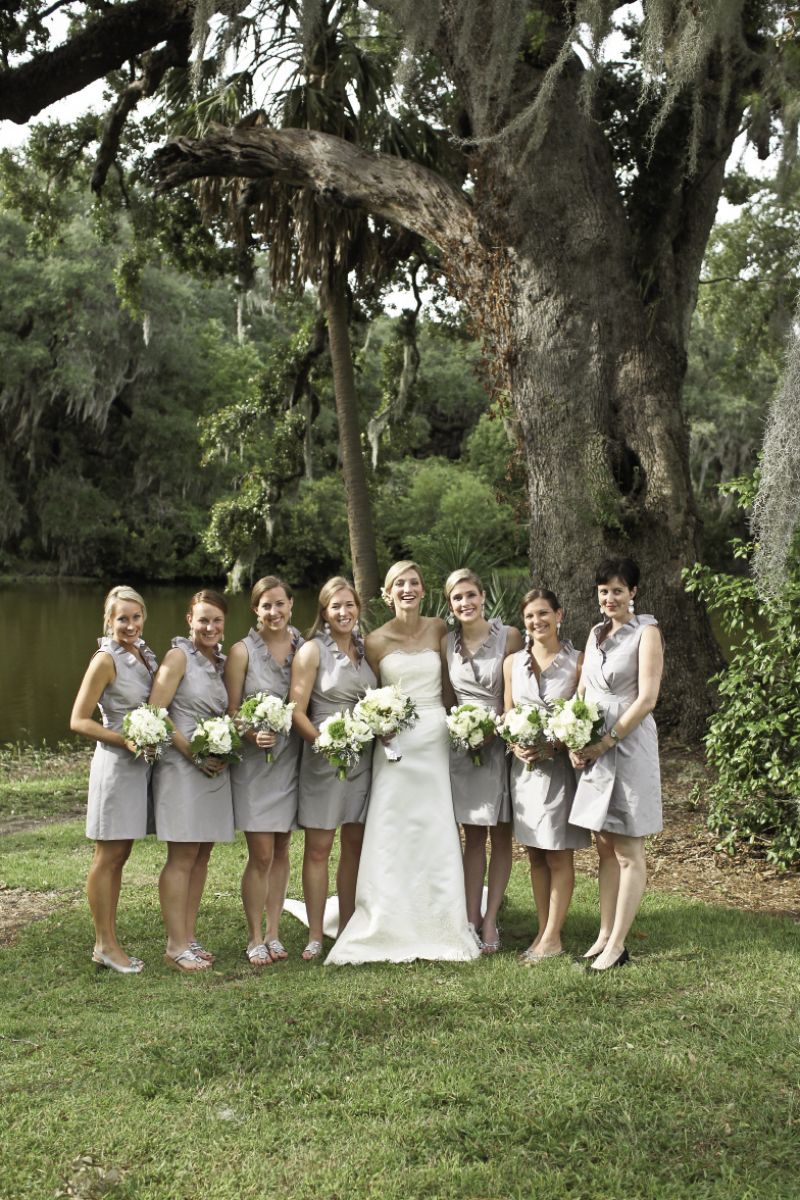 DRESS TO IMPRESS: The soft driftwood hue of the bridesmaids’ J.Crew frocks complemented both the bride’s custom gown and the majestic surroundings.