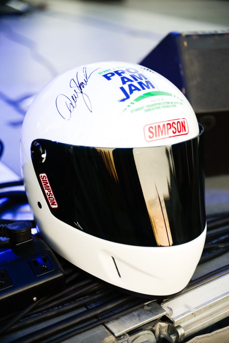 Autographed Denny Hamlin helmets were auctioned off