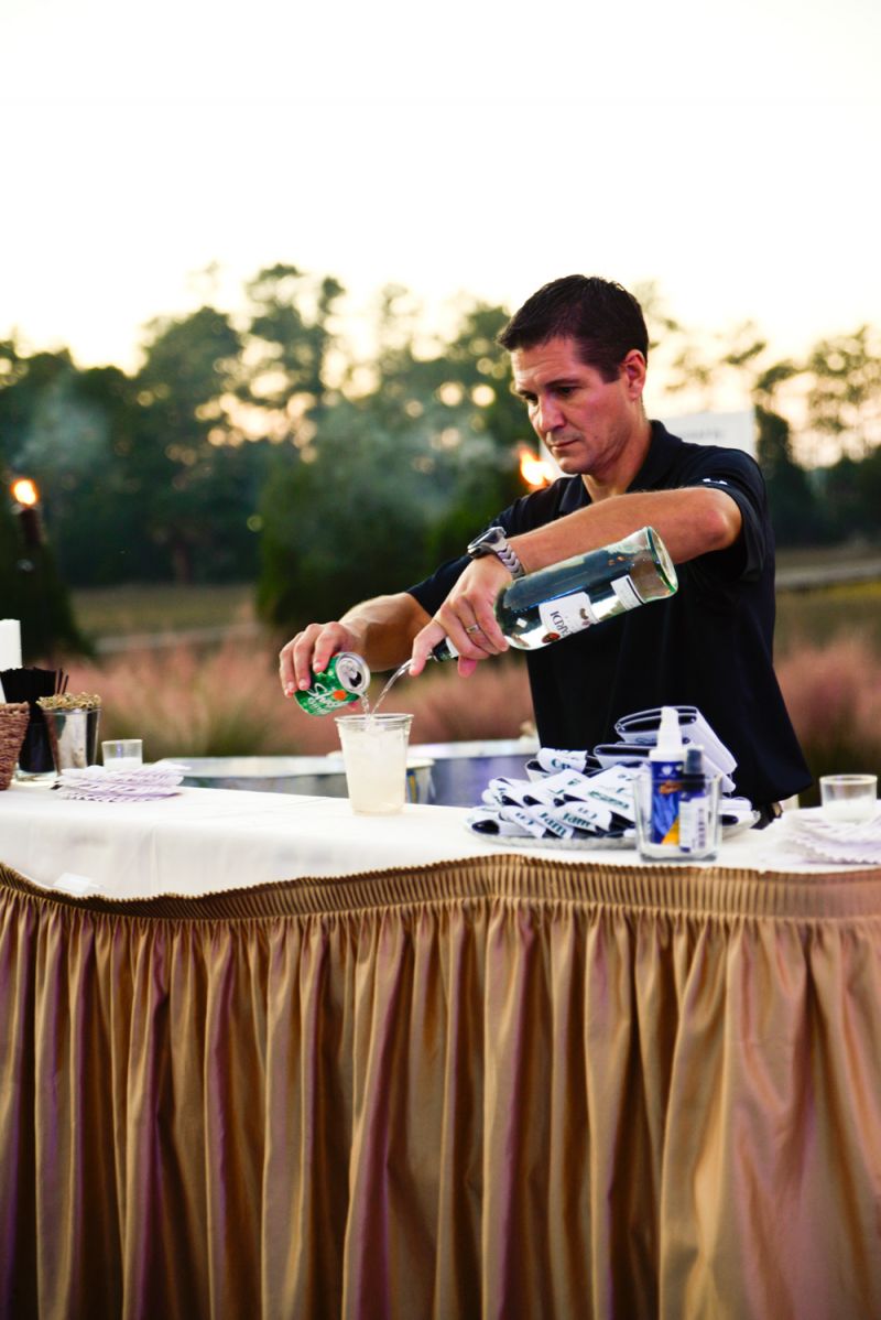 Bartender hard at work mixing drinks for guests