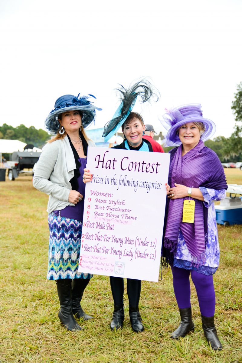 Candace Hunt, Archie Burkel, and Brenda Taylor showcase the hat contest categories.