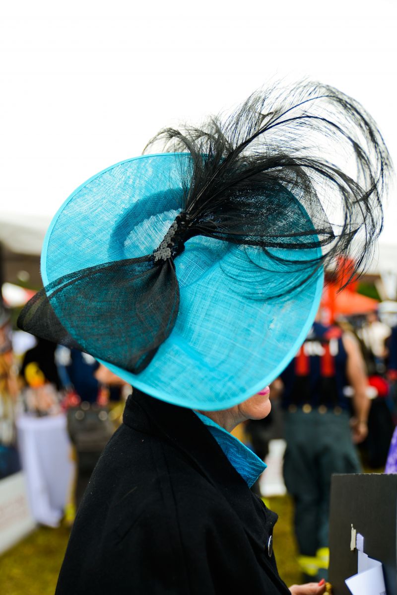 Archie Burkel models her bold, blue hat.