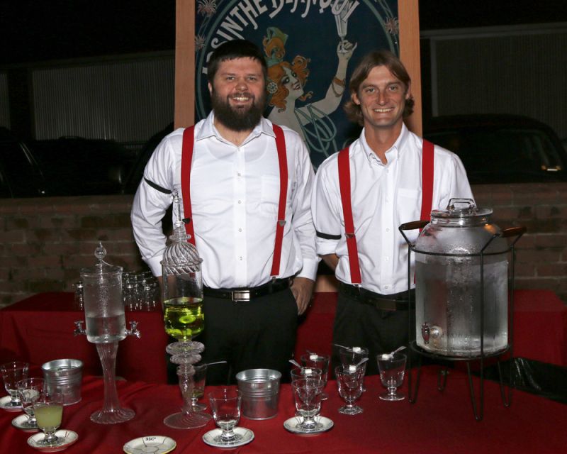 Bartenders stood at the ready behind the absinthe bar.
