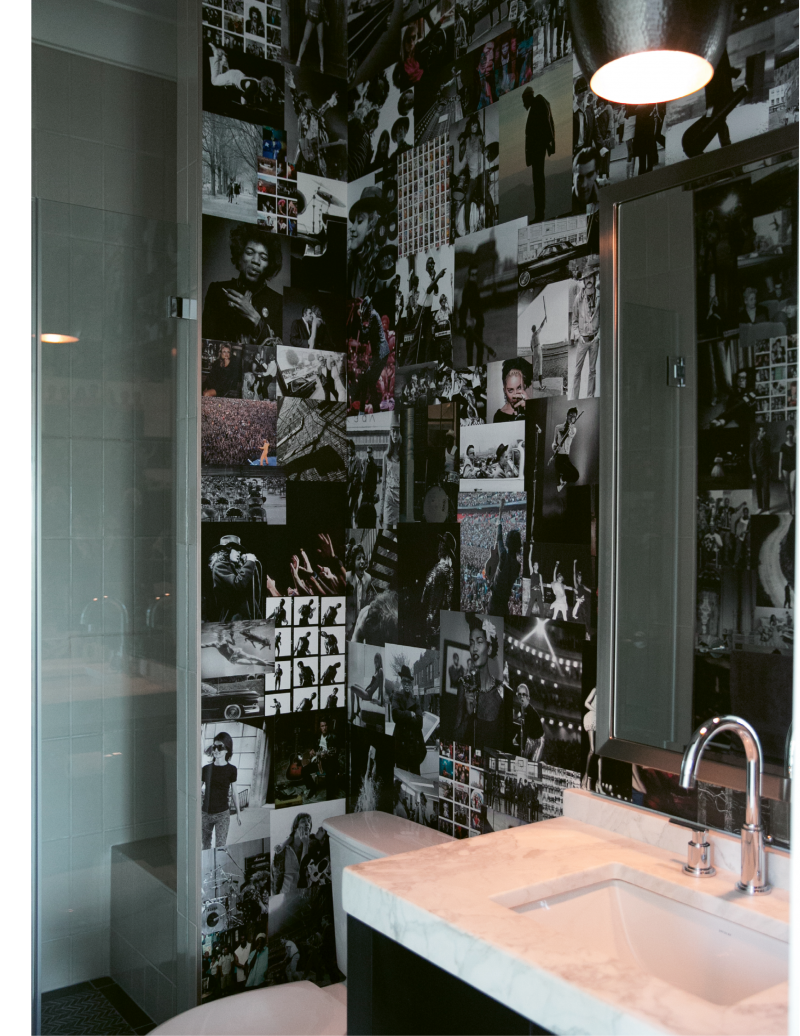 Melissa and Brad made the wallpaper in this first-floor bath themselves, using favorite photos of musicians they ripped from coffee-table books.