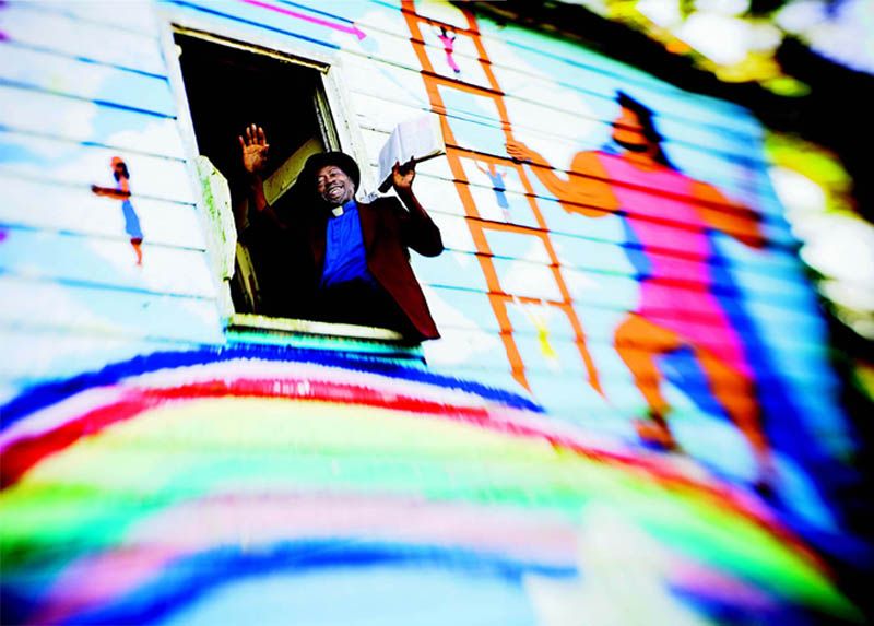 The Rev. Robert Parks and his Crosstown mural “Jesus Is the Only Fire Escape”