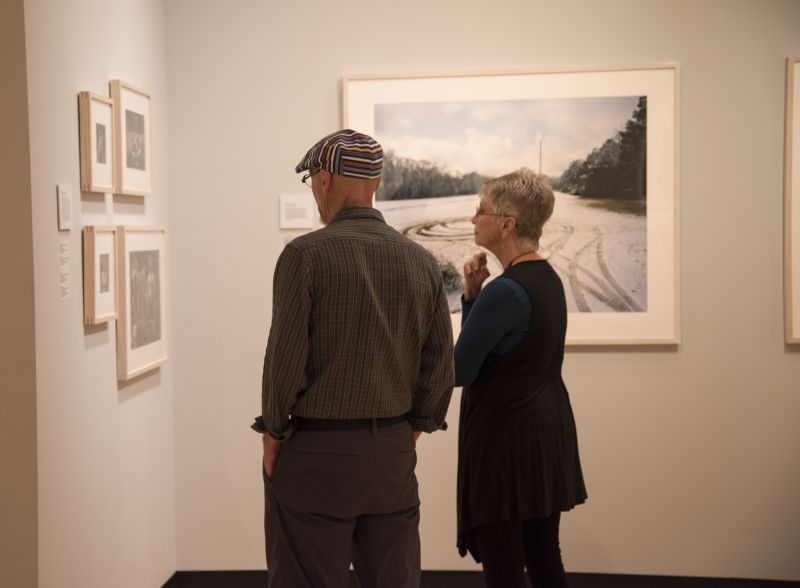 Attendees take in works in the “Southbound” exhibition.