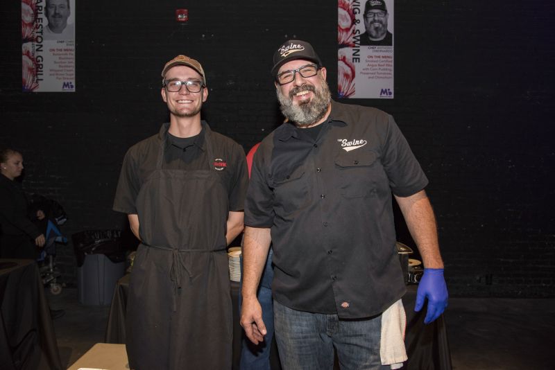 The event&#039;s lead chef, Anthony DiBernardo of Swig &amp; Swine (right), with a team member