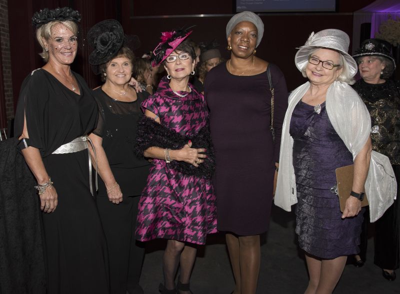 Attendees dressed to the nines for the event, like these ladies donning fascinators.