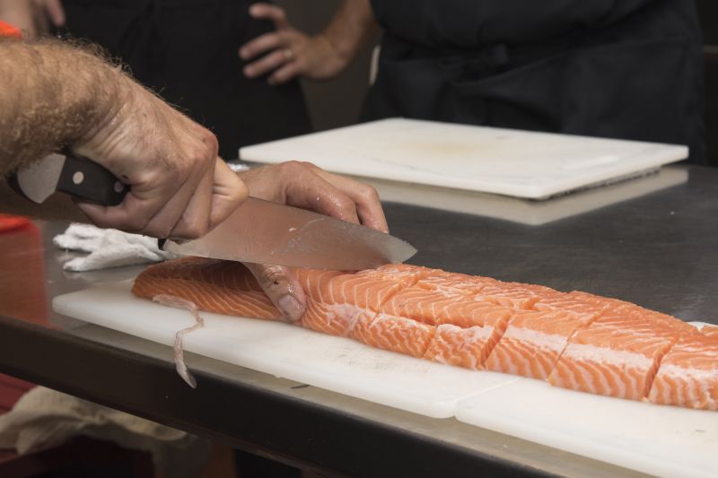 Chef Casciello demonstrates how to properly cut salmon.