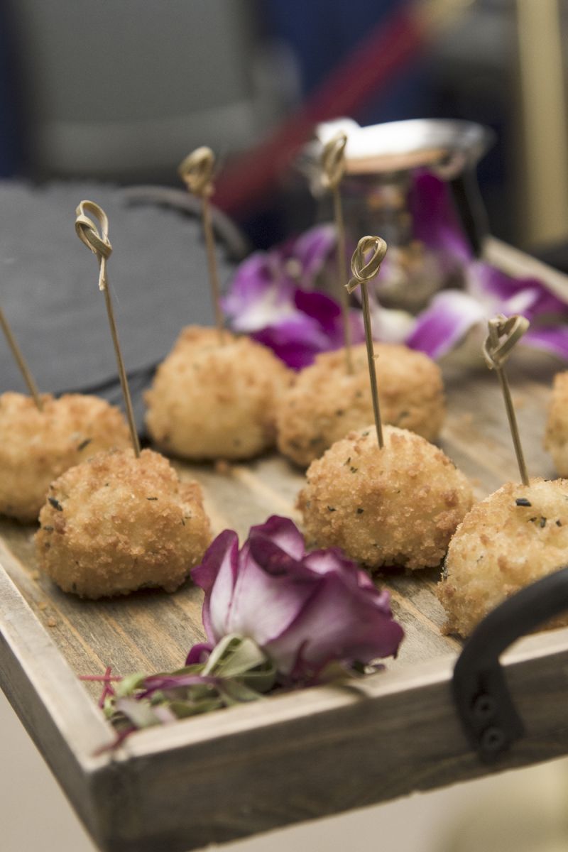 Guests could indulge in hors d&#039;oeuvres such as these rice balls before sitting down for dinner.