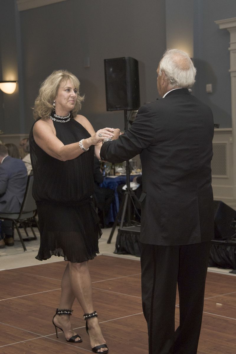 Once in the dining room, many guests danced both before and after the dinner and live auction.