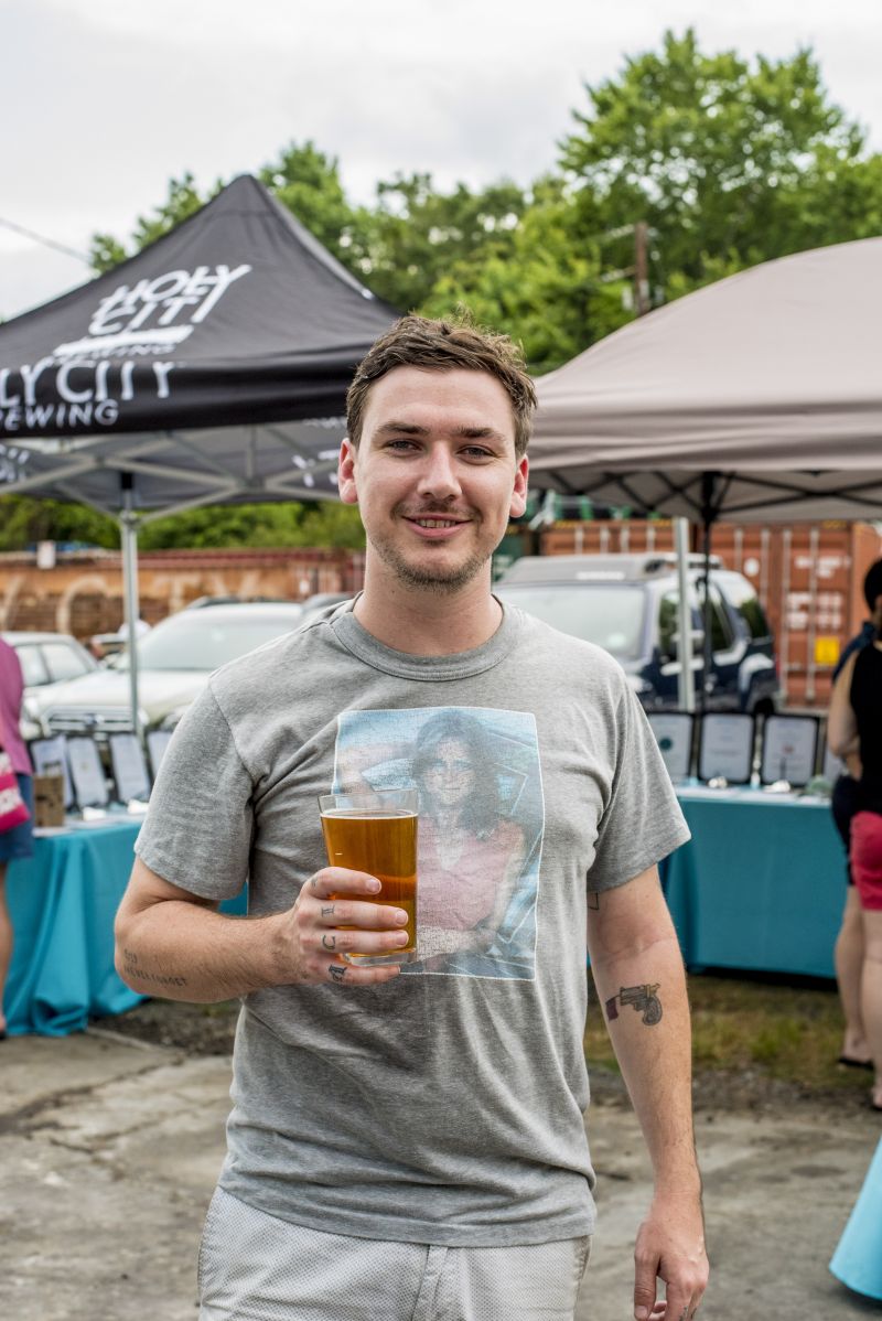 Musician Justin Osborne took a break from his set to grab a beer.