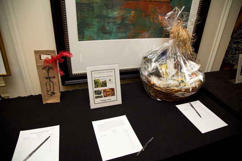 Items in the silent auction, including a Napa Valley wine tasting experience