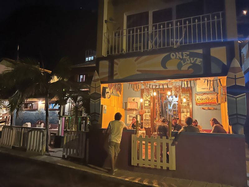 A typical evening at Maktub Pub in Paúl do Mar, a favorite for surfers; the eatery’s simple menu of beverages; and ceviche prepared table side.