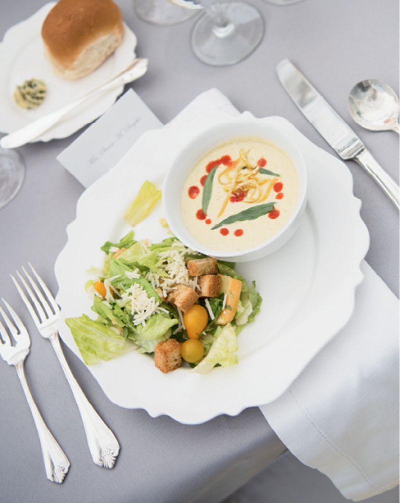 Caesar salad and chilled corn bisque served by Salthouse Catering