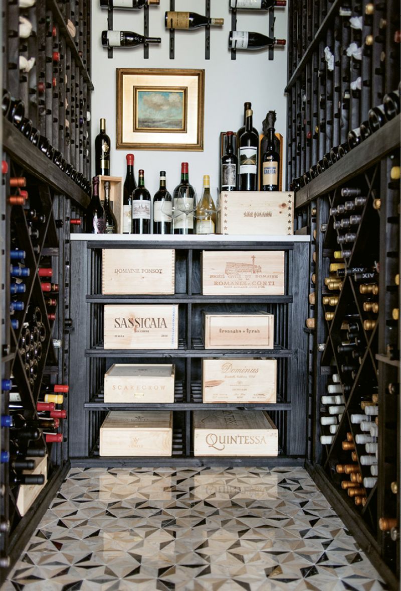 A walk-in wine cellar located off the foyer houses vintages collected during the family’s global travels.