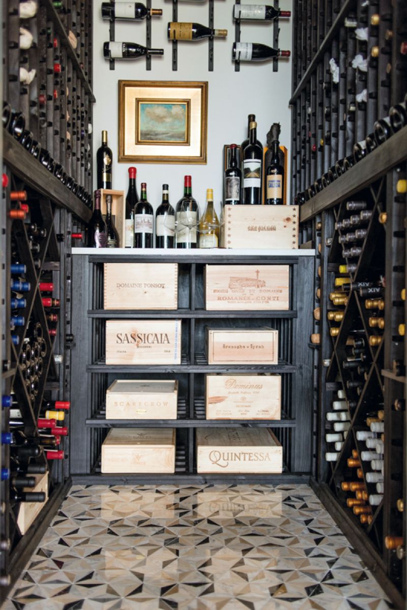A walk-in wine cellar located off the foyer houses vintages collected during the family’s travels.