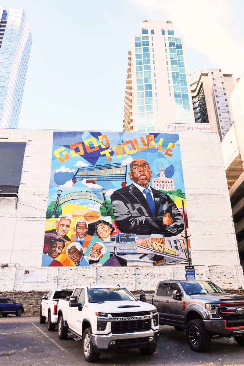 Vibrant colors pop up all over town—with murals featuring late US Representative John Lewis of Georgia and...