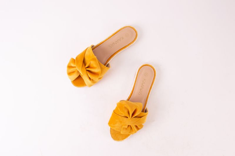 Kaanas espadrille slide-ons in “marigold,” $108 at Maris Dehart