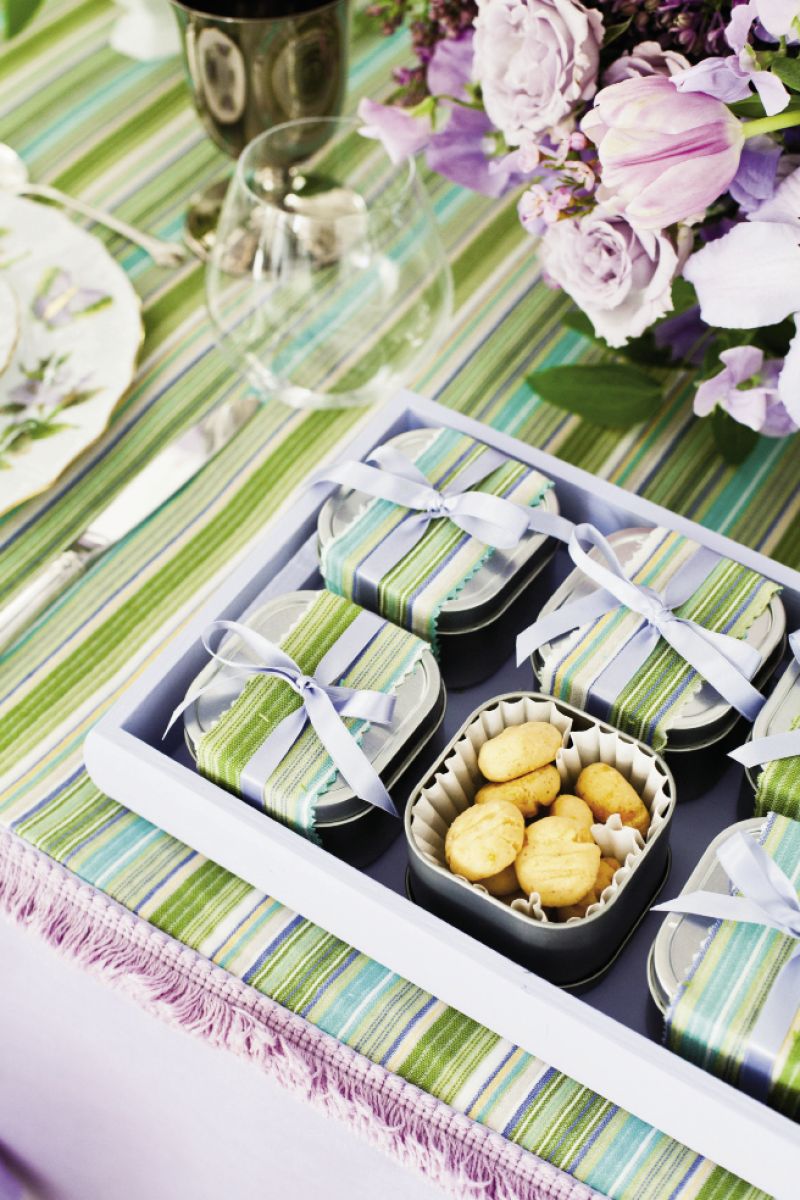 LIGHT BITE: Small boxes of Kimberly Glenn’s cheese “straws” were wrapped in tablecloth remnants and tied with pale lilac ribbon.
