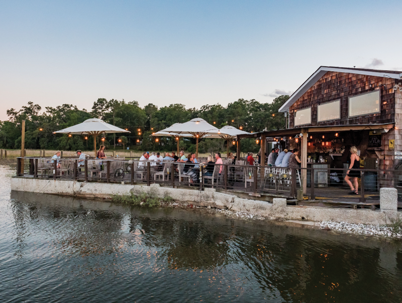 and the rustic waterfront scene at sunset—all at The Wyld.
