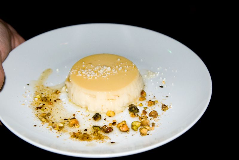 Orange blossom flan with salted caramel and candied pistachios from Cru Catering