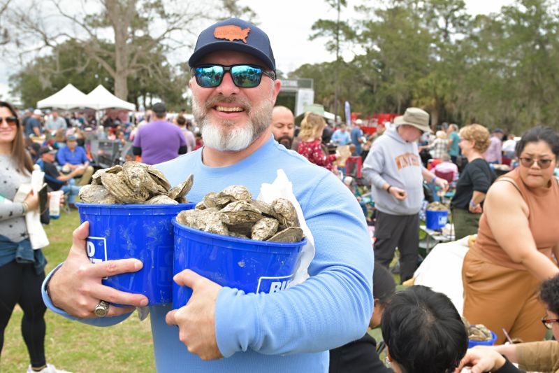 Steamed oysters were available for purchase by the bucket.