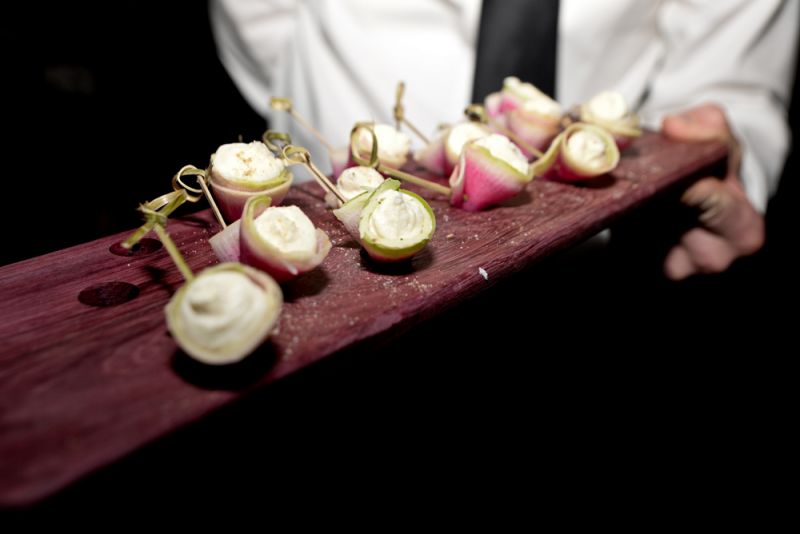 Shaved watermelon radish crostini with a brown butter puree from Cru Catering