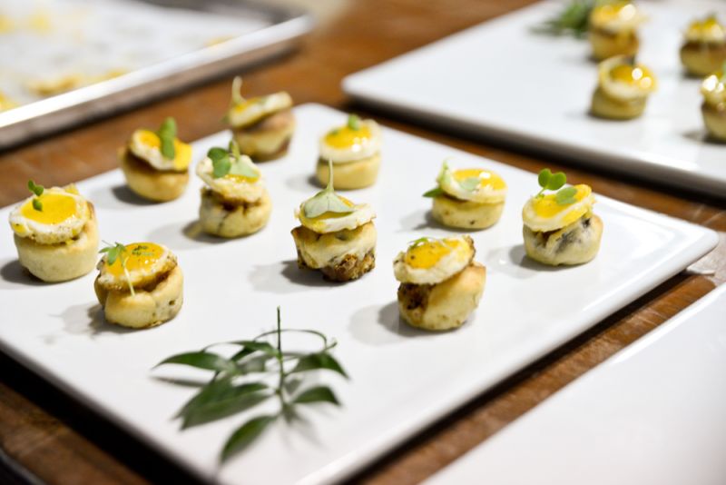Cru Catering plated up miniature &quot;monte cristo&quot; sandwiches topped with quail eggs.