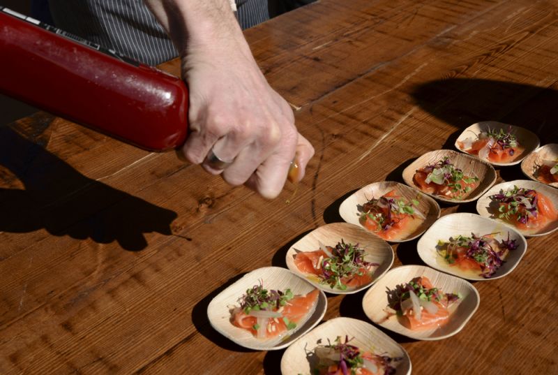 Chef Michael Kramer of Greenville&#039;s The Lazy Goat plated salmon crudo with pickled fennel.