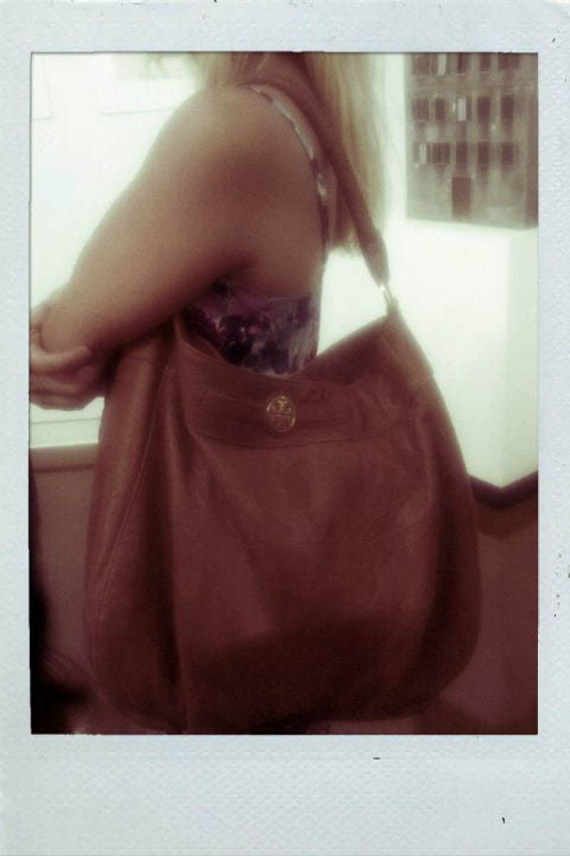 Lauren&#039;s stylish oversized Tory Burch handbag.