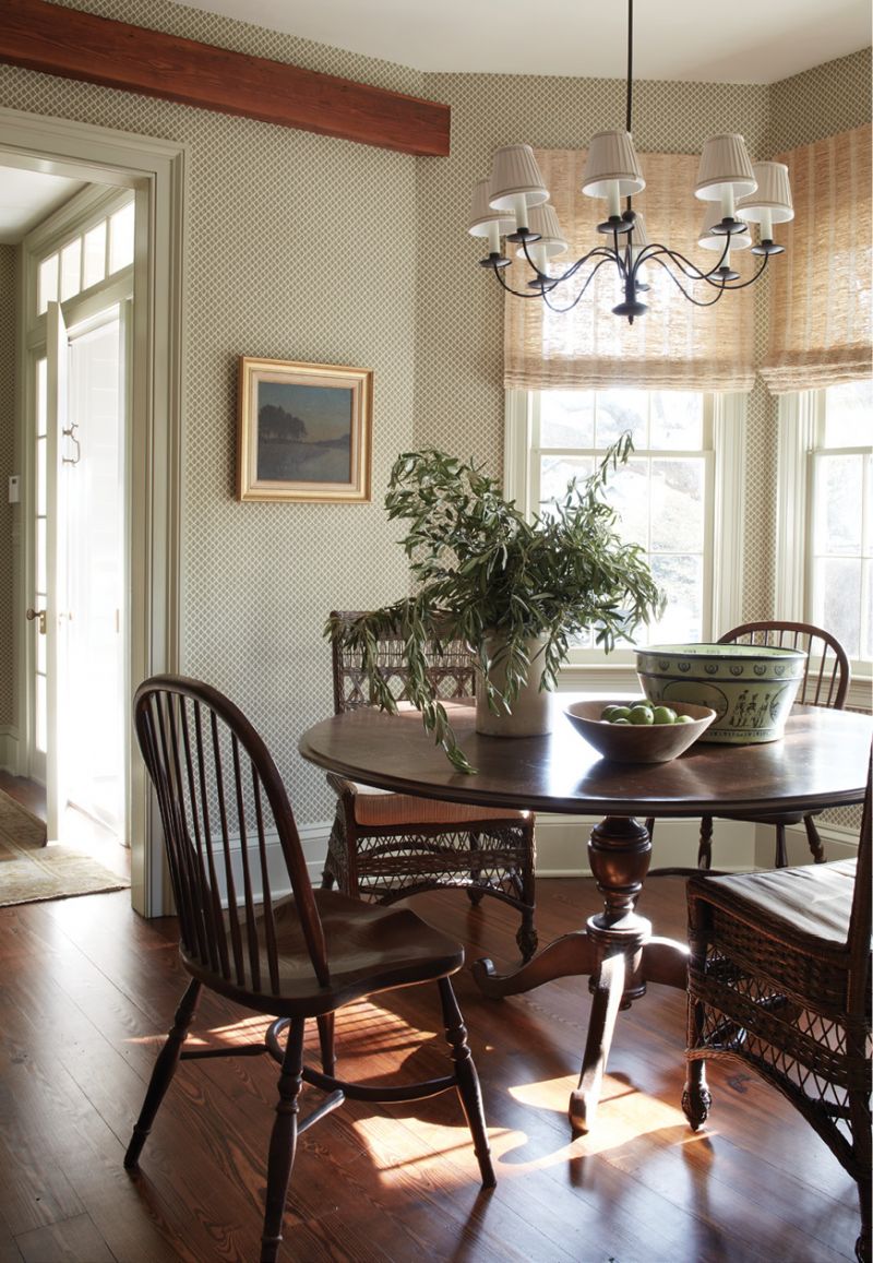The single-room wide home continues back through the living room to a bright breakfast room where an English Regency dining table from Nietert Antique Restorations provides a spot to soak up the morning sun.