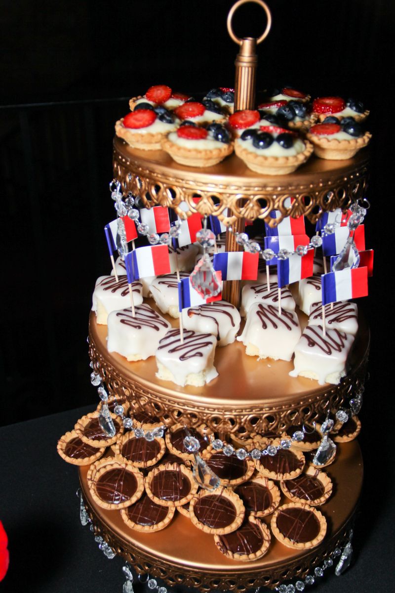 Dessert tier included fruit tarts, petits fours with French flags, and chocolate ganache tarts.