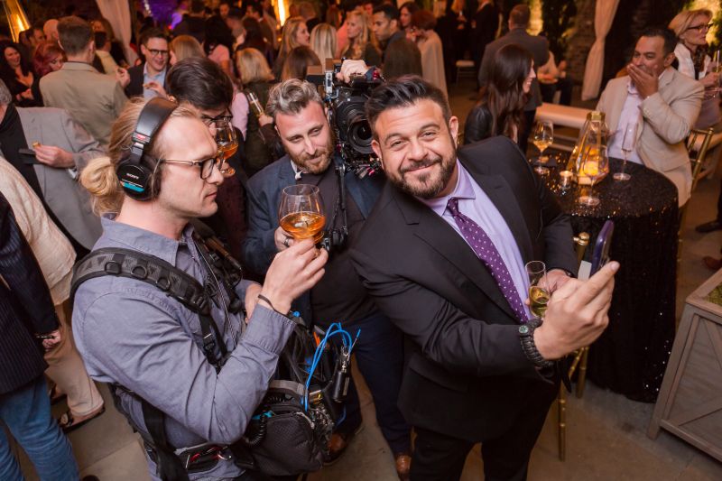Adam Richman takes a selfie with his film crew.