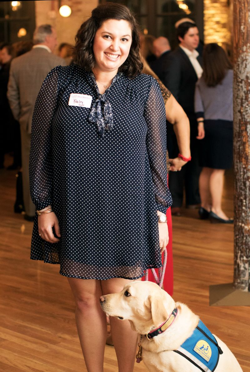 Dee Norton therapist Bailey Jackson and the organization’s therapy dog, Poppy