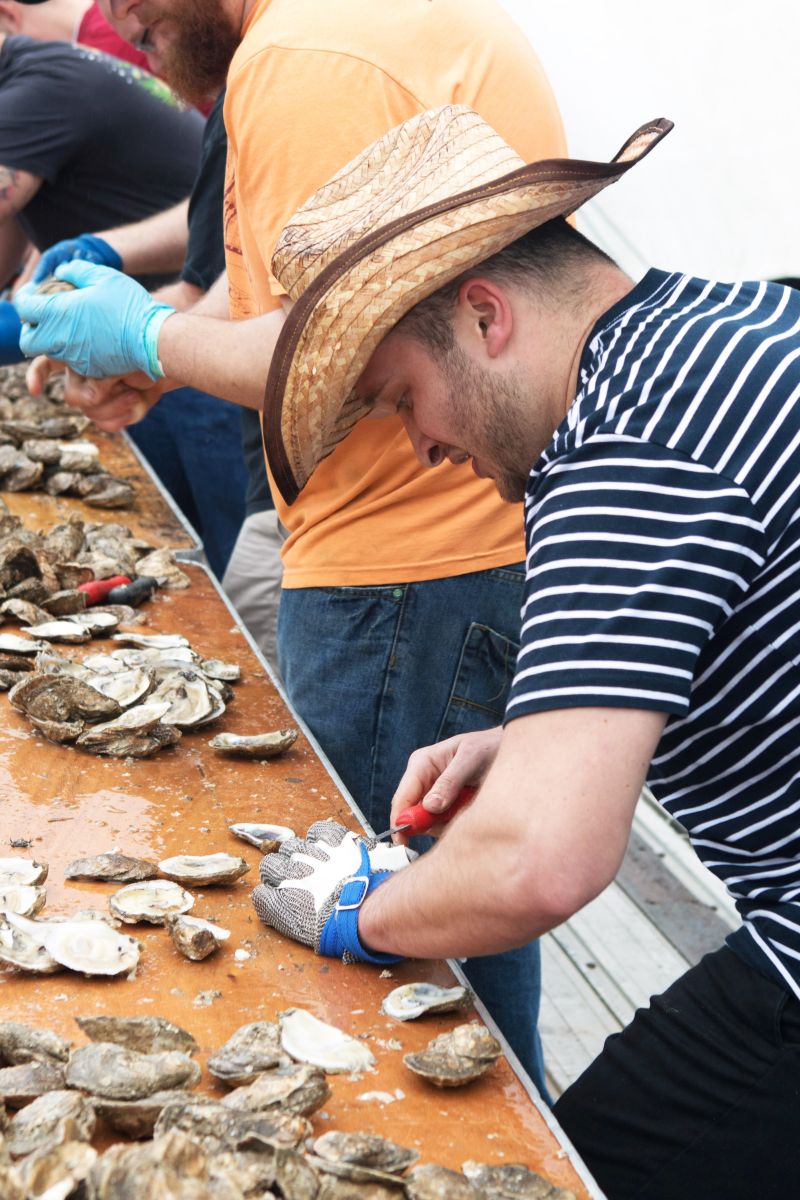 Contestants shucked furiously in hopes of taking home the first place trophy.