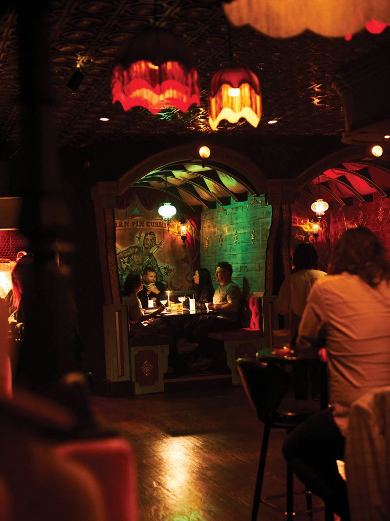 Saturday night at Tiger Bar, with its vintage, gin-joint vibe including fringe-draped lights and sideshow murals.