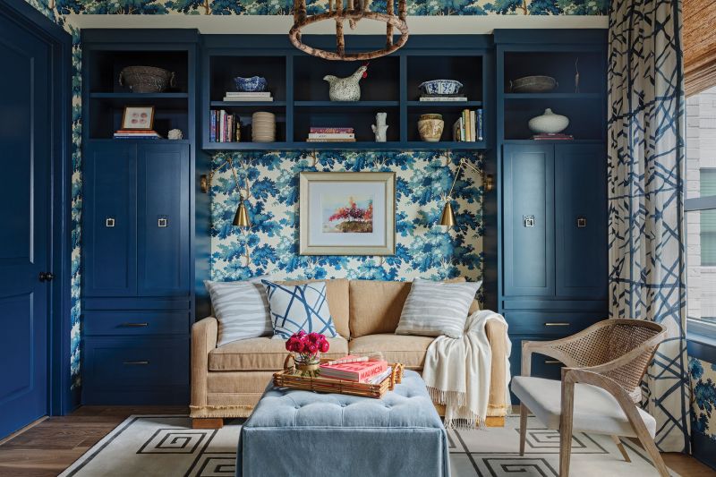 True Blue: The guest room/office/second sitting room is a riot of color courtesy of the bold Scalamandré wallpaper and custom cabinets painted blue.