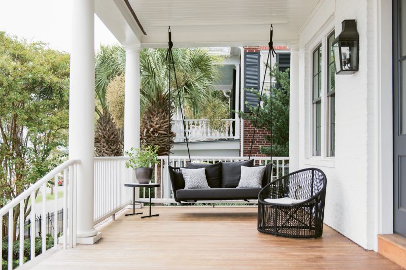 A sculptural loveseat-size swing by Spanish company Kettal provides a modern twist on the classic Charleston front-porch experience.