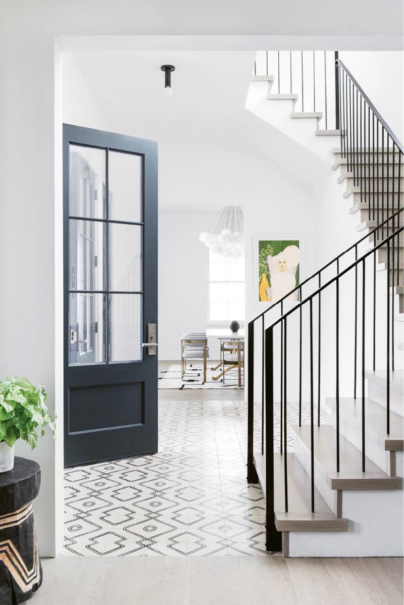 In this informal entry, Exquisite Surfaces “Commune” cement tile in the “Navajo Zebra” pattern sets a playful tone. “It’s a lively welcome to the house via our side doors, which most friends and family use,” Molly notes.