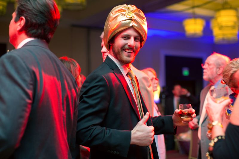 A turbaned guest enjoyed dancing and drinks.