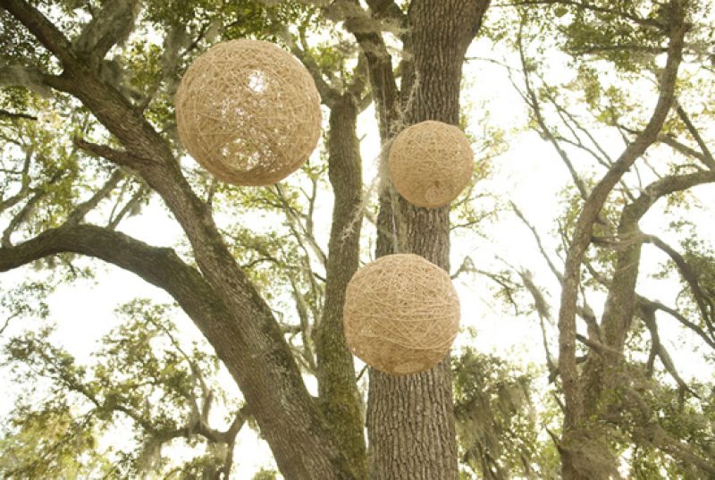 OUTDOOR ORBS: A windy storm rolled through just before the ceremony began, so most some décor, including colorful prayer flags, were taken down or moved under the tents by Lee’s family. These twine balls, however, remained hanging with rustic charm.