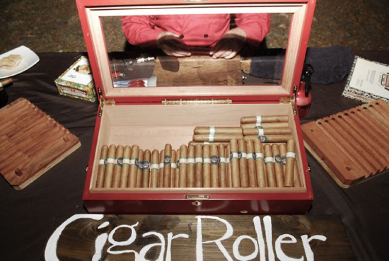 WORK HARD, PLAY HARD: Dave, who is founder and principal of the local company Cigar Row, had a employee man a rolling station during the reception.
