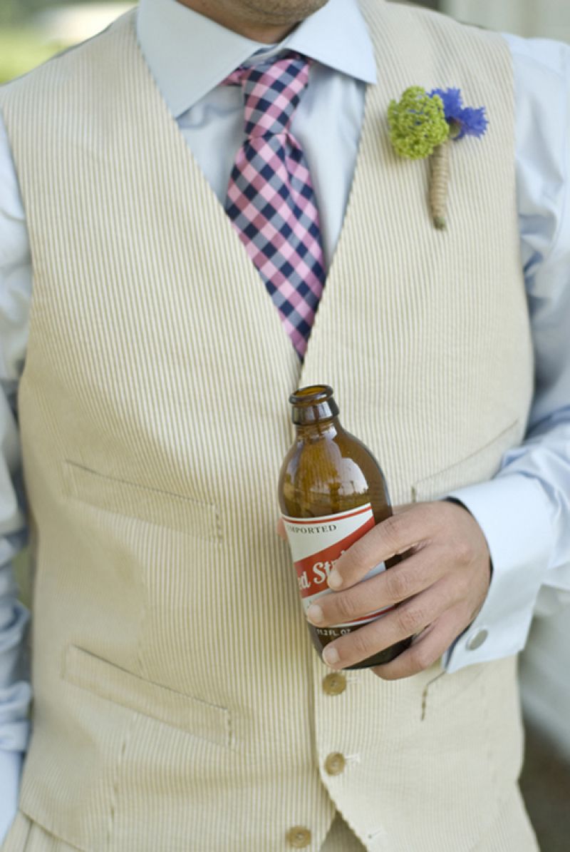 IT’S THE LITTLE THINGS: Duvall Catering &amp; Event Design fashioned a twine-garnished wildflower boutonniere to complement the groom’s off-the-rack J.Crew suit. The bar, which was stocked with the couple’s drink of choice, Red Stripe, was open for guests before and during the ceremony.