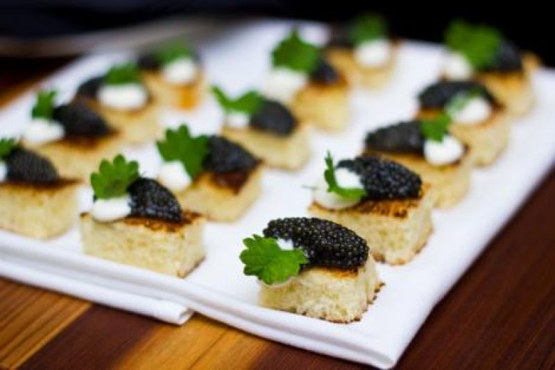 Featured hors d&#039;oeuvres included fresh caviar, roasted tomato puree, and braised lamb.